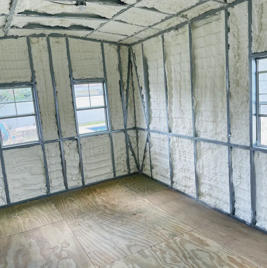 Closed-cell spray foam insulation applied to wall cavities in a residential project in Belpre